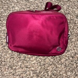 Lululemon waist bag in maroon. Like new. NWOT